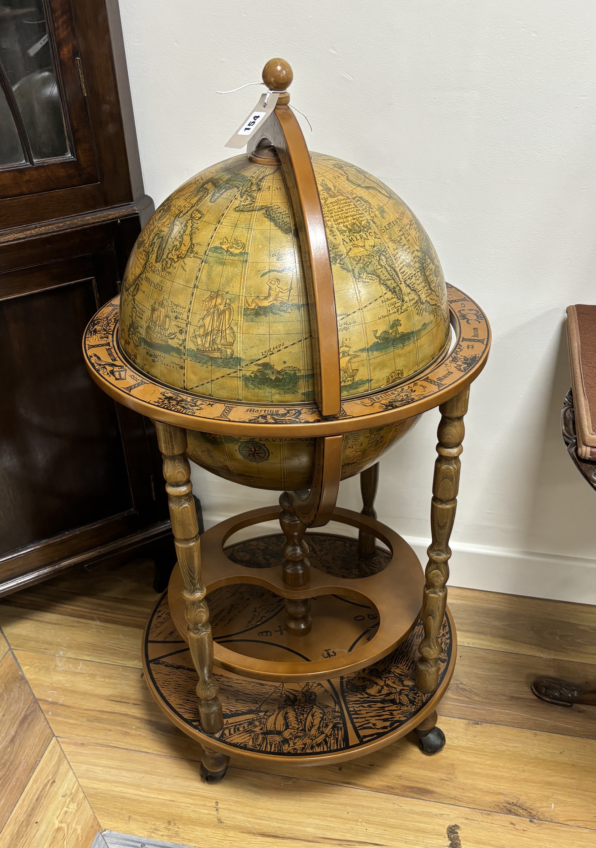 A reproduction globe drinks trolley, height 92cm